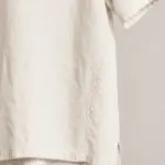 Cream shirt fabric and hem detail